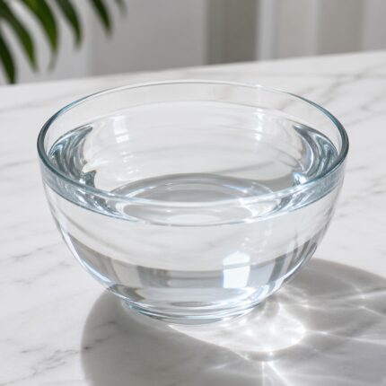 Caprylic/Capric Triglyceride (CCTG) clear lightweight oil in a glass bottle used as an emollient in cosmetic formulations.