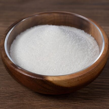 DL Panthenol powder fine white crystalline powder in a glass bowl used for moisturizing and hair care formulations.