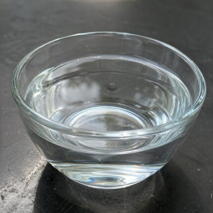 Carbitol clear hygroscopic liquid in glass container used as solvent and coupling agent in formulations