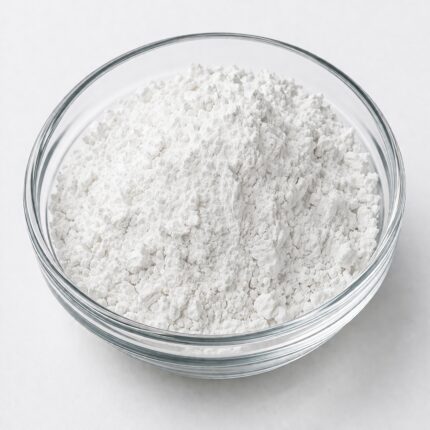 White to off-white crystalline powder of Climbazole in a glass bowl, used as an antifungal agent in anti-dandruff and scalp care formulations.
