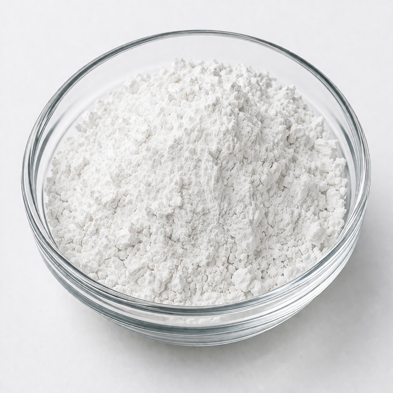Climbazole White to off-white crystalline powder of Climbazole in a glass bowl, used as an antifungal agent in anti-dandruff and scalp care formulations.