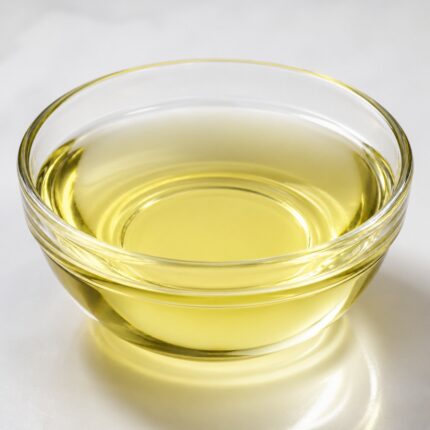 PEG-7 Glyceryl Cocoate clear to pale yellow liquid in glass container for cosmetic formulation use