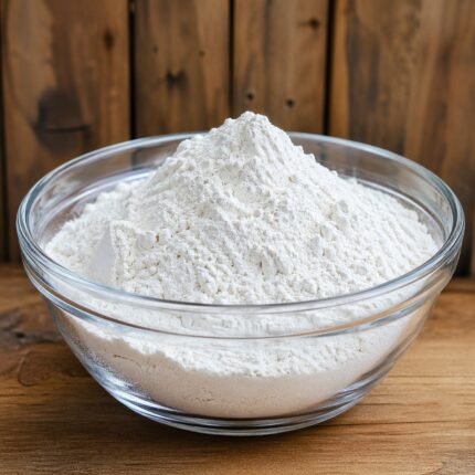 Titanium dioxide dispersion smooth white liquid in a glass container used as a pigment and opacifier in cosmetic formulations.