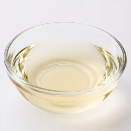 Auxyl clear liquid preservative solution in a glass container used for cosmetic and personal care formulations.