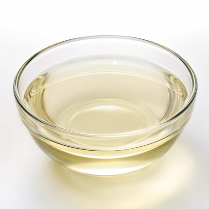 Coco Betaine liquid in clear glass bowl Cocamidopropyl Betaine mild surfactant liquid Transparent Coco Betaine cosmetic ingredient Coco Betaine gentle foaming agent in bowl Coco Betaine raw material for skincare products
