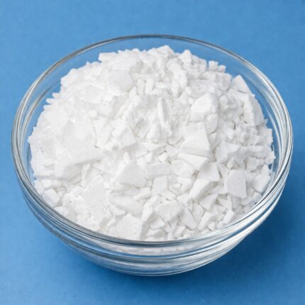 Emulsifying wax pellets in a glass container, showing their white, solid bead-like texture.