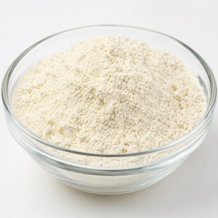 Hydrolyzed keratin powder fine off-white protein powder in glass bowl for hair and cosmetic formulations