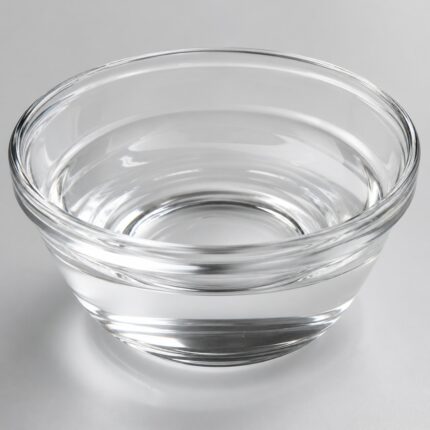 Clear, lightweight liquid of Isododecane in a glass container, smooth texture and fast-evaporating appearance suitable for cosmetic formulations.