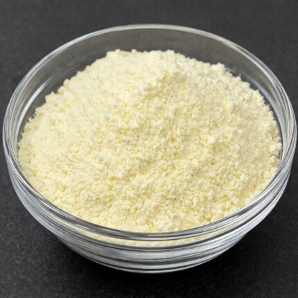 Fine white crystalline powder of Mandelic acid in a glass bowl, smooth texture and cosmetic-grade appearance.