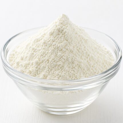 Sodium Lauryl Glutamate fine white powder in glass bowl, mild plant-based surfactant for skincare and cleansing formulations