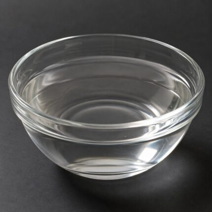 Clear, viscous liquid of Sorbitol in a glass container, smooth texture and colorless appearance suitable for cosmetic and food use.