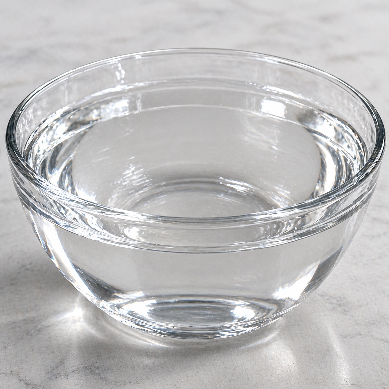 Thioglycolic acid Thioglycolic acid liquid in a glass container, showing its clear, colorless to pale yellow appearance.