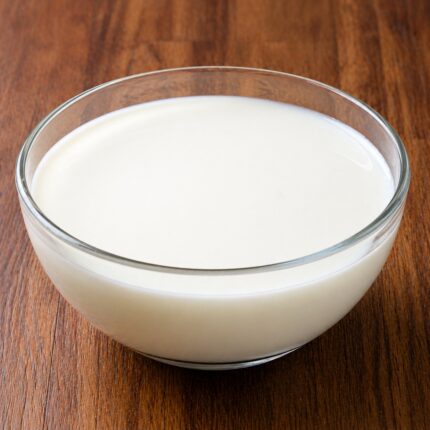 XIAMETER 1785 silicone fluid in a clear container, showing its transparent, low-viscosity liquid appearance.