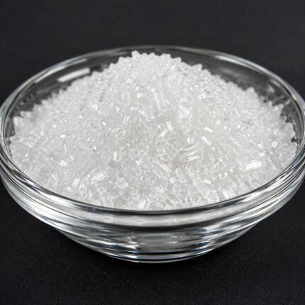 Xylitol white crystalline powder in a container, commonly used as a natural sweetener in food, pharmaceutical, and oral care formulations.