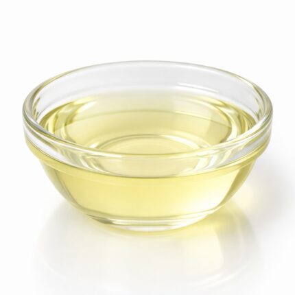 Methyl salicylate clear liquid in a glass container, commonly used in topical formulations for its warming effect and characteristic wintergreen aroma.